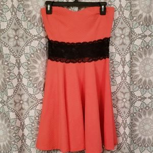 Coral and black strapless dress
